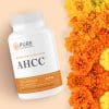 bottle of AHCC against a group of flowers.